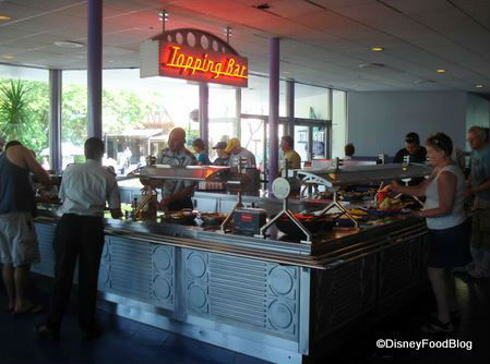 Unlimited toppings available to enhance any entrée. Photo courtesy of Disney Food Blog