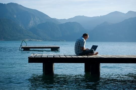 Man Sitting on a Dock with His Computer - Photo courtesy of ©iStockphoto.com/Claudiad, Image #10484365