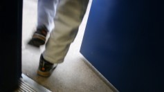 Close-up of feet walking out door. Photo by woodleywonderworks at Flickr.
