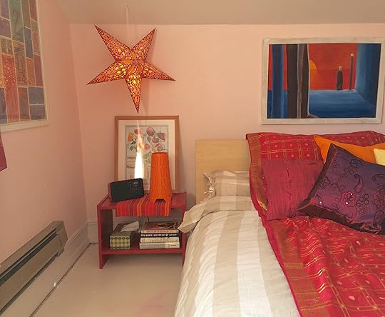 The side tables are the same IKEA RAST units that were there for the last decade or more -- only now, they've been painted a shiny red gloss. The hanging star was found at Goodwill.