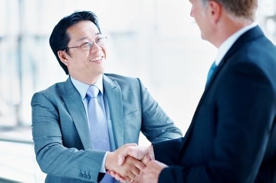 Two Business Executives Shaking Hands - Photo courtesy of ©iStockphoto.com/kupicoo, Image #18859584