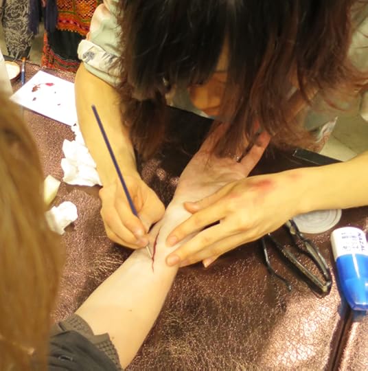 Next, fake blood was painted into the slash.