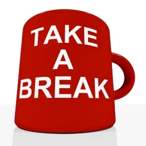 A red coffee mug that says Take a Break on it