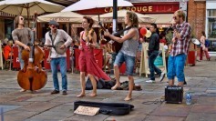A musical group busking in a public square