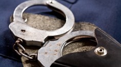 Handcuffs being taken out of bag