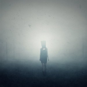 woman with bag in fog