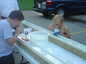 Cubscouts compete in a Raingutter Regatta race