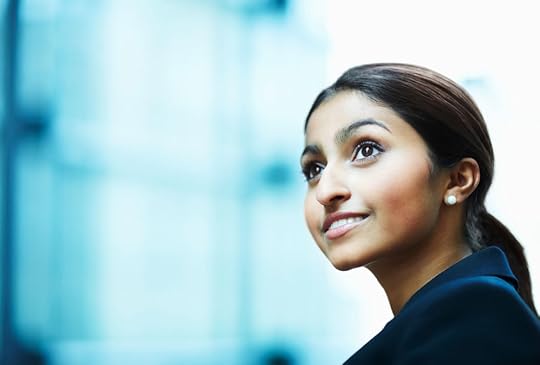 Woman looking away and smiling. © GlobalStock via iStock.