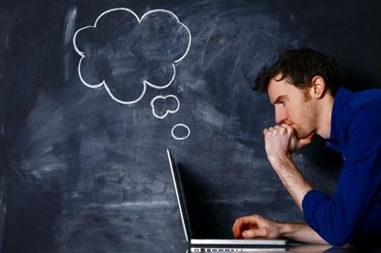 Man with a Laptop Against a Blackboard - Photo courtesy of ©iStockphoto.com/mattjeacock, Image #19460301