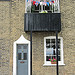 Flags on a house in Ballast Quay, Greenwich