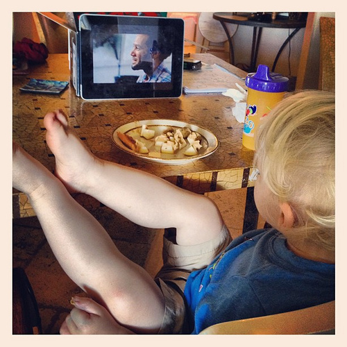 This is True's idea of relaxing. Ben Harper on YouTube, a snack, and legs propped up on the table. #happiness