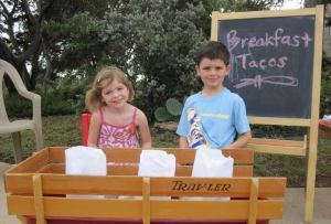 Malia and Owen Shafer with their taco wagon.