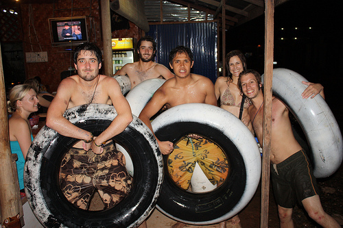 Backpackers tubing in Vang Vieng, Laos.