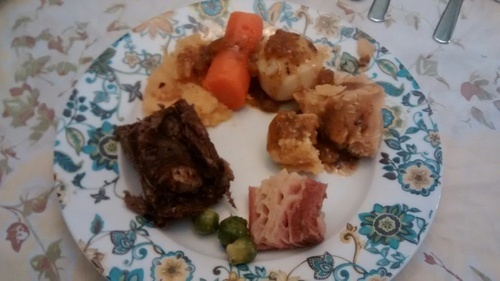 Confession time. When I cooked yesterday, I didn't have cabbage. Forgot to get it. And I forgot to get turnip greens, which are awesome. So I used brussel sprouts, which I hate. I put three teeny ones on my plate just to pretend so the wee one would eat his. Here's what's on the plate, clockwise: Carrots, potato, pease pudding, salt beef, yucky brussel sprouts, a huge piece of moose roast and mashed turnip. The hole in the centre of the plate is because when I was talking up dinner I was imaging piling my greens in there. So I left a space for respect. :) 