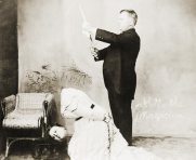 Early 20th century magician, David P. Abbott, beheads a lady.