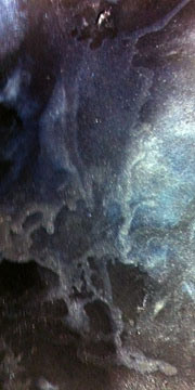 Color sample of Dutch Blue, Interference Blue, Shimmering Black on black Artagain paper.
