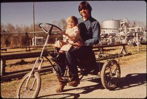 Fisherman and child on home-made bike, Nara