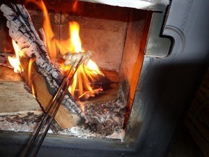 Charring ginger in the wood stove.
