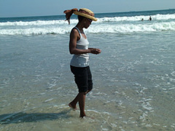 Wambui walking on beach