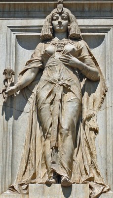 One of two female figures at the entrance to the Egyptian Museum in Cairo; given that the museum opened in 1902, she is probably supposed to be either Cleopatra or Isis