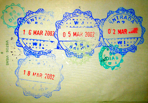 Multiple Bolivia entry stamps in a passport.