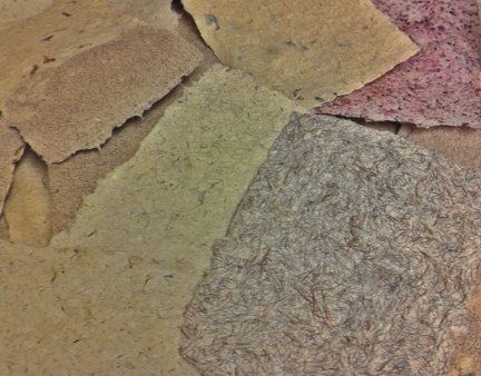 L to R, bottom row: thistledown, iris, corn silk in abaca. Top row, L to R: ocotillo flower in iris, iris with silk ribbon bits, abaca with hibiscus flowers. 