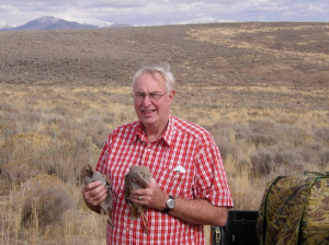 Dad proudly poses with his double. 