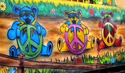 Three bears steering peace signs.