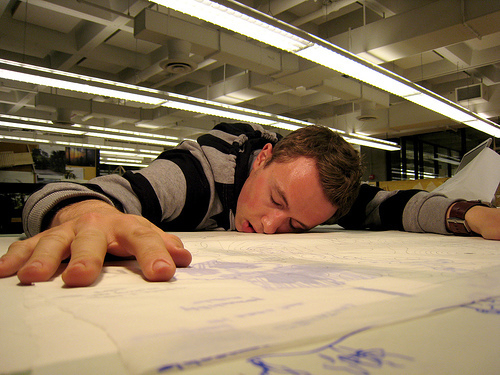 An exhausted designer in a studio.