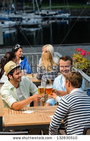 stock-photo-three-men-drinking-beer-at-terrace-bar-enjoying-night-out-132830510 (1)