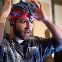 Conor wears an early prototype of the OpenBCI 3D-printable EEG Headset.