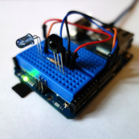 A mini breadboard fits perfectly snug between the Yún's header sockets.
