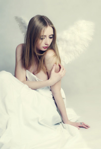 Young woman angel with wings