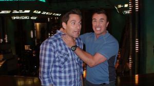 Writer-producer Alan McCullough receiving script notes from actor Paul McGillion.