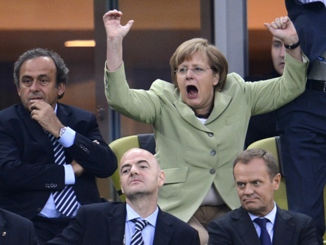 merkel-cheers.jpg