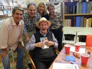 Jack Beritzhoff (Front) Signs His Memoir, Sail Away: Journeys of a Merchant Seaman. Back: John Beritzhoff, David Kudler (Publisher), Alex Beritzhoff, Lisa Beritzhoff