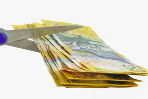 scissors cutting money © GeorgeMPhotograohy