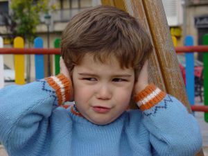 Kid covering ears