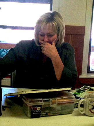 Working on her painting.