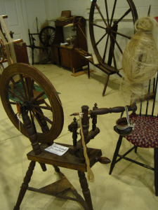 This is a spinning wheel from the Landis Valley Museum. The white stuff on the distaff are the flax fibers--what a straw stalk lacks.