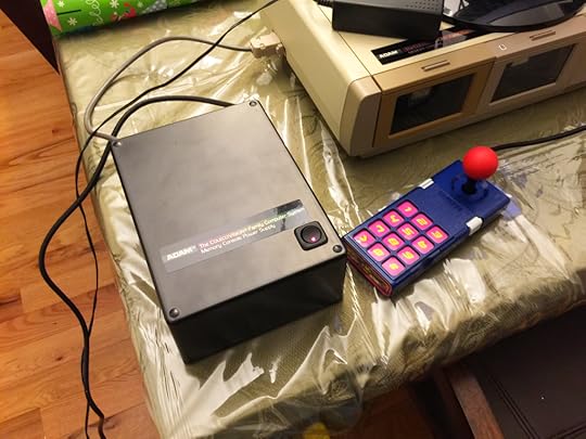 My power supply next to a customized original ColecoVision controller for size comparison. Despite a scratch near the top rear of the power supply, I'm quite happy with how it turned out.