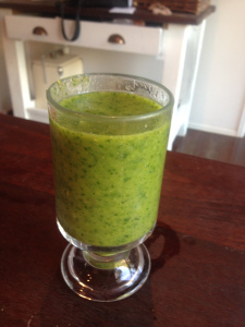 A green smoothie I made with a stick blender - banana, flaxseeds, spinach leaves, fresh mint, parsley