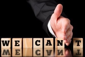 Businessman Creating Positive Saying from Blocks