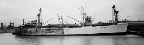 Assault ship Empire Elaine on the Clyde in early 1943, being refitted and repainted in preparation for Operation Husky.