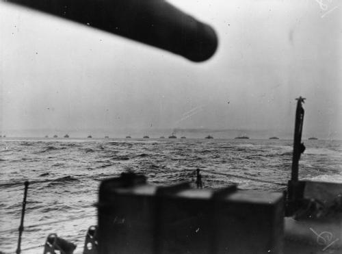 Early morning view on 10 July of one of the assault convoys approaching Sicily, showing the tail-end of the rough seas which had hampered progress during the previous day (Admiralty Official Collection, Imperial War Museum A 18096).