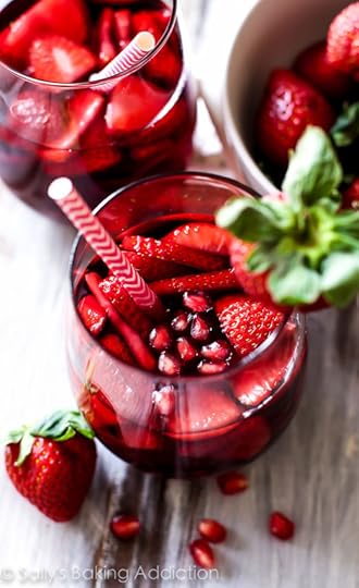 Strawberry Pomegranate Sangria Recipe-- this is so easy to throw together and it's dangerously good. Tastes like sparkling pomegranate strawberry juice!