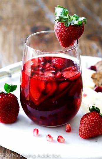 Strawberry Pomegranate Sangria Recipe-- this is so easy to throw together and it's dangerously good. Tastes like sparkling pomegranate strawberry juice!
