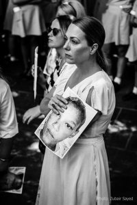 Protester holding pic of Anene - Zubair Sayed