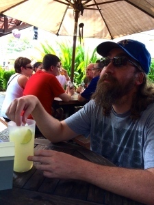 Photo of a man with a drink in Jaco.