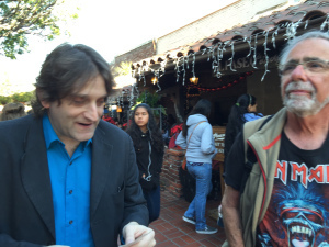 Bret Shefter and Jim Moscovich work out a cryptic crossword clue while strolling Olvera Street.